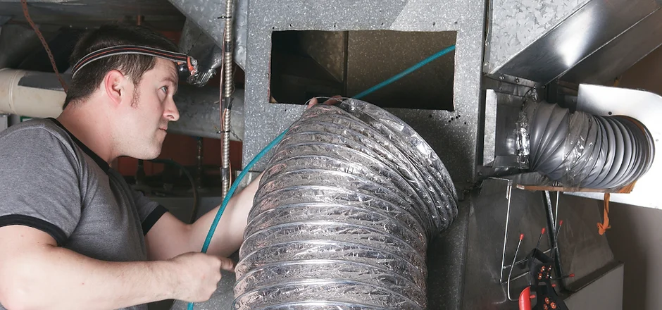 an expert checking ventilation system